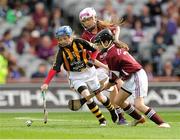 30 September 2012; Alix Buckley, Skerries Harps, Dublin, representing Kilkenny, in action against Karin Blair, Rockwell Rovers, Tipperary, and Ciara Brennan, St. Killian's, Offaly, back, representing Galway, during the INTO/RESPECT Exhibition GoGames at the GAA Hurling All-Ireland Senior Championship Final Replay between Kilkenny and Galway. Croke Park, Dublin. Picture credit: Pat Murphy / SPORTSFILE