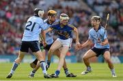 30 September 2012; Tomas Hamill, Tipperary, in action against James Roche, 21, Paul Winters and Cian Boland, right, Dublin. Electric Ireland GAA Hurling All-Ireland Minor Championship Final Replay, Dublin v Tipperary, Croke Park, Dublin. Picture credit: Ray McManus / SPORTSFILE