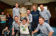 1 October 2012; Sean Burke O'Neill, aged 10, from Maynooth, Co. Kildare, with his father John, lifts the Liam MacCarthy Cup alongside Kilkenny players from left, Paul Murphy, Walter Walsh, Eoin Larkin, Tommy Walsh and Richie Hogan during a visit to Our Lady's Hospital for Sick Children, Crumlin, Dublin. Picture credit: Barry Cregg / SPORTSFILE
