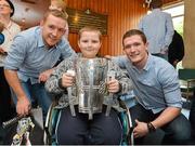 1 October 2012; Nathan O'Hagan-Doyle, aged 10, from Bray, Co. Wicklow, holds the Liam MacCarthy Cup alongside Kilkenny's Richie Hogan, left, and Paul Murphy during a visit to Our Lady's Hospital for Sick Children, Crumlin, Dublin. Picture credit: Barry Cregg / SPORTSFILE