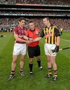 30 September 2012; Galway captain Fergal Moore and Kilkenny captain Eóin Larkin look on as referee James McGrath tosses a commemorative Michael Collins coin before the GAA Hurling All-Ireland Senior Championship Final Replay match between Kilkenny and Galway at Croke Park in Dublin. Photo by Ray McManus/Sportsfile