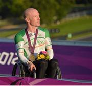 5 September 2012; Ireland's Mark Rohan, from Ballinahown, Co. Westmeath, during the national anthem after receiving his gold medal after victory in the men's individual H 1 time trial. London 2012 Paralympic Games, Cycling, Brands Hatch, Kent, England. Picture credit: Brian Lawless / SPORTSFILE