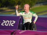 5 September 2012; Ireland's Mark Rohan, from Ballinahown, Co. Westmeath, celebrates as he waits to receive his gold medal after victory in the men's individual H 1 time trial. London 2012 Paralympic Games, Cycling, Brands Hatch, Kent, England. Picture credit: Brian Lawless / SPORTSFILE
