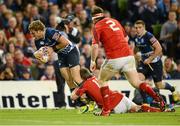 6 October 2012; Ian Madigan, Leinster, goes over for his side's second try despite the tackle of Ronan O'Gara, Munster. Celtic League 2012/13, Round 6, Leinster v Munster, Aviva Stadium, Lansdowne Road, Dublin. Picture credit: Stephen McCarthy / SPORTSFILE