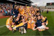 7 October 2012; The Antrim team celebrate with the cup after the game. TG4 All-Ireland Ladies Football Junior Championship Final, Antrim v Louth, Croke Park, Dublin. Picture credit: Brendan Moran / SPORTSFILE