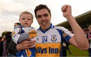 7 October 2012; Paul Quinn, Errigal Ciaran, celebrates with his daughter Maggie Quinn after the game.  Tyrone County Senior Football Championship Final, Dromore v Errigal Ciaran, Healy Park, Omagh, Co. Tyrone. Photo by Sportsfile