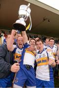 7 October 2012; Neil McGarvey, left, Michael McRory, and Ronan McRory, right, Errigal Ciaran, celebrate with the O'Neill cup.  Tyrone County Senior Football Championship Final, Dromore v Errigal Ciaran, Healy Park, Omagh, Co. Tyrone. Photo by Sportsfile