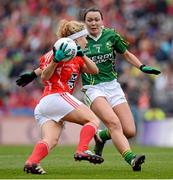 7 October 2012; Caroline Kennedy, Kerry, rushes in to tackle Cork's Valerie Mulcahy. TG4 All-Ireland Ladies Football Senior Championship Final, Cork v Kerry, Croke Park, Dublin. Picture credit: Ray McManus / SPORTSFILE