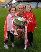 7 October 2012; Cork's Deirdre O'Reilly with Ailey Lyons and Annie O'Reilly and the Brendan Martin Cup after the game. TG4 All-Ireland Ladies Football Senior Championship Final, Cork v Kerry, Croke Park, Dublin. Picture credit: Brendan Moran / SPORTSFILE