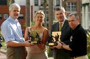 16 January 2002; All-Ireland Final referees Aodán Mac Suibhne, right, Dublin, Hurling, and John Bannon, left, Longford, Football, are presented with their Vodafone GAA All-Star Referee Awards by Tara Delaney, Director of Communications, Vodafone (Ireland) Ltd., and GAA President Sean McCague at lunch in their honour, US Grant Wyndham Hotel, Broadway, San Diego, USA. Picture credit; Ray McManus / SPORTSFILE    *EDI*