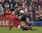 18 January 2003; Junior Paramore, Gloucester, is tackled by John Hayes, Munster. Munster v Gloucester, Heineken European Cup, Thomond Park,  Limerick. Rugby. Picture credit; Brendan Moran / SPORTSFILE *EDI*
