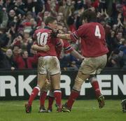 18 January 2003; Munster's John Kelly is congratulated by team-mates Ronan O'Gara, left, and Donnacha O'Callaghan (4) after scoring his sides 4th try in the last minute of the game against Gloucester. Munster v Gloucester, Heineken European Cup, Thomond Park,  Limerick. Rugby. Picture credit; Brendan Moran / SPORTSFILE *EDI*