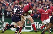 18 January 2003; Anthony Foley, Munster, is tackled by Junior Paramore, Gloucester. Heineken European Cup, Munster v Gloucester, Thomond Park Limerick. Rugby. Picture credit; Brendan Moran / SPORTSFILE *EDI*