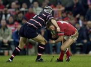 18 January 2003; Ronan O'Gara, Munster, is tackled by Andy Hazell, Gloucester. Heineken European Cup, Munster v Gloucester, Thomond Park, Co. Limerick. Rugby. Picture credit; Brendan Moran / SPORTSFILE *EDI*