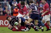 18 January 2003; Junior Paramore, Gloucester, is put under pressure by John Hayes, grounded, and Donnacha O'Callaghan, Munster. Heineken European Cup, Munster v Gloucester, Thomond Park, Co. Limerick. Rugby. Picture credit; Brendan Moran / SPORTSFILE *EDI*