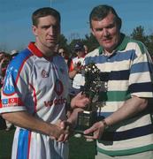 18 January 2003; GAA President Sean McCague makes a presentation to the winning captain Kieran McGeeney after the game. Vodafone GAA All-Star Exhibition Game, Vodafone 2002 All-Stars v Vodafone 2001 All-Stars, University of San Diego, Alcalá Park, San Diego, California, USA. Picture credit; Ray McManus / SPORTSFILE *EDI*