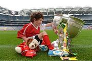 10 October 2012; Pictured at the Kellogg’s Cúl Dream Day Out in Croke Park is Oisin McCarthy, age 6, from Innishannon, Co. Cork, with 'Mario' and the Sam Maguire Cup. 82,000 children participated in Kellogg's GAA Cúl Camps in 2012, an increase of almost 6% on 2011, proving that the camps are one of the most popular summer camps, selected by Irish families. Over 1,000 clubs throughout the country hosted Kellogg's GAA Cúl Camps, during the summer of 2012, with the highest numbers participating in GAA strongholds like Dublin, Cork, Galway, Limerick and Kildare. Counties like Meath, Westmeath and Longford also saw a huge surge in camp registrations with numbers up by 41% in Meath, 34% in Westmeath, 21% in Mayo, 20% in Longford and 8% in Donegal. Croke Park, Dublin. Picture credit: Brian Lawless / SPORTSFILE