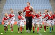 10 October 2012; Pictured at the Kellogg’s Cúl Dream Day Out in Croke Park is Down footballer Brendan Coulter with children from the Under 10 football group. 82,000 children participated in Kellogg's GAA Cúl Camps in 2012, an increase of almost 6% on 2011, proving that the camps are one of the most popular summer camps, selected by Irish families. Over 1,000 clubs throughout the country hosted Kellogg's GAA Cúl Camps, during the summer of 2012, with the highest numbers participating in GAA strongholds like Dublin, Cork, Galway, Limerick and Kildare. Counties like Meath, Westmeath and Longford also saw a huge surge in camp registrations with numbers up by 41% in Meath, 34% in Westmeath, 21% in Mayo, 20% in Longford and 8% in Donegal. Croke Park, Dublin. Picture credit: Brian Lawless / SPORTSFILE