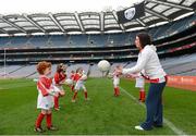 10 October 2012; Pictured at the Kellogg’s Cúl Dream Day Out in Croke Park is Wexford's Ursula Jacobs with Brid Hunt, age 6, from Artane, Co. Dublin. 82,000 children participated in Kellogg's GAA Cúl Camps in 2012, an increase of almost 6% on 2011, proving that the camps are one of the most popular summer camps, selected by Irish families. Over 1,000 clubs throughout the country hosted Kellogg's GAA Cúl Camps, during the summer of 2012, with the highest numbers participating in GAA strongholds like Dublin, Cork, Galway, Limerick and Kildare. Counties like Meath, Westmeath and Longford also saw a huge surge in camp registrations with numbers up by 41% in Meath, 34% in Westmeath, 21% in Mayo, 20% in Longford and 8% in Donegal. Croke Park, Dublin. Picture credit: Brian Lawless / SPORTSFILE