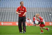 10 October 2012; Pictured at the Kellogg’s Cúl Dream Day Out in Croke Park is Down footballer Brendan Coulter with Nicole Kerley, age 8, from Monaghan. 82,000 children participated in Kellogg's GAA Cúl Camps in 2012, an increase of almost 6% on 2011, proving that the camps are one of the most popular summer camps, selected by Irish families. Over 1,000 clubs throughout the country hosted Kellogg's GAA Cúl Camps, during the summer of 2012, with the highest numbers participating in GAA strongholds like Dublin, Cork, Galway, Limerick and Kildare. Counties like Meath, Westmeath and Longford also saw a huge surge in camp registrations with numbers up by 41% in Meath, 34% in Westmeath, 21% in Mayo, 20% in Longford and 8% in Donegal. Croke Park, Dublin. Picture credit: Brian Lawless / SPORTSFILE