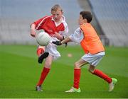 10 October 2012; Pictured at the Kellogg’s Cúl Dream Day Out in Croke Park are Eoghan Heffernan, left, age 10, from Newcastleconnell, Co. Limerick, in action against Kevin Byrne, age 9, from Boyle, Co. Roscommon. 82,000 children participated in Kellogg's GAA Cúl Camps in 2012, an increase of almost 6% on 2011, proving that the camps are one of the most popular summer camps, selected by Irish families. Over 1,000 clubs throughout the country hosted Kellogg's GAA Cúl Camps, during the summer of 2012, with the highest numbers participating in GAA strongholds like Dublin, Cork, Galway, Limerick and Kildare. Counties like Meath, Westmeath and Longford also saw a huge surge in camp registrations with numbers up by 41% in Meath, 34% in Westmeath, 21% in Mayo, 20% in Longford and 8% in Donegal. Croke Park, Dublin. Picture credit: Barry Cregg / SPORTSFILE