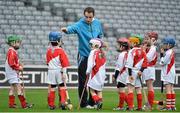 10 October 2012; Pictured at the Kellogg’s Cúl Dream Day Out in Croke Park is Dublin hurler Ryan Dwyer giving instructions to Cúl Dream Day Out winners. 82,000 children participated in Kellogg's GAA Cúl Camps in 2012, an increase of almost 6% on 2011, proving that the camps are one of the most popular summer camps, selected by Irish families. Over 1,000 clubs throughout the country hosted Kellogg's GAA Cúl Camps, during the summer of 2012, with the highest numbers participating in GAA strongholds like Dublin, Cork, Galway, Limerick and Kildare. Counties like Meath, Westmeath and Longford also saw a huge surge in camp registrations with numbers up by 41% in Meath, 34% in Westmeath, 21% in Mayo, 20% in Longford and 8% in Donegal. Croke Park, Dublin. Picture credit: Barry Cregg / SPORTSFILE