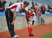 10 October 2012; Pictured at the Kellogg’s Cúl Dream Day Out in Croke Park is Laois manager Justin McNulty speaking to the injured Luke Fitzgerald, age 8, from Dundrum, Dublin. 82,000 children participated in Kellogg's GAA Cúl Camps in 2012, an increase of almost 6% on 2011, proving that the camps are one of the most popular summer camps, selected by Irish families. Over 1,000 clubs throughout the country hosted Kellogg's GAA Cúl Camps, during the summer of 2012, with the highest numbers participating in GAA strongholds like Dublin, Cork, Galway, Limerick and Kildare. Counties like Meath, Westmeath and Longford also saw a huge surge in camp registrations with numbers up by 41% in Meath, 34% in Westmeath, 21% in Mayo, 20% in Longford and 8% in Donegal. Croke Park, Dublin. Picture credit: Barry Cregg / SPORTSFILE