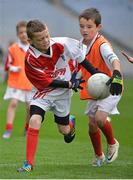 10 October 2012; Pictured at the Kellogg’s Cúl Dream Day Out in Croke Park are Brian Gallagher, left, age 10, from Carbury, Co. Kildare, in action against Aaron Dolan, age 9, from Curraghboy, Co. Roscommon. 82,000 children participated in Kellogg's GAA Cúl Camps in 2012, an increase of almost 6% on 2011, proving that the camps are one of the most popular summer camps, selected by Irish families. Over 1,000 clubs throughout the country hosted Kellogg's GAA Cúl Camps, during the summer of 2012, with the highest numbers participating in GAA strongholds like Dublin, Cork, Galway, Limerick and Kildare. Counties like Meath, Westmeath and Longford also saw a huge surge in camp registrations with numbers up by 41% in Meath, 34% in Westmeath, 21% in Mayo, 20% in Longford and 8% in Donegal. Croke Park, Dublin. Picture credit: Barry Cregg / SPORTSFILE
