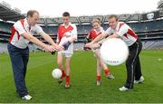 10 October 2012; Pictured at the Kellogg’s Cúl Dream Day Out in Croke Park are Niall Clerkin, age 12, from Louth, and Amy Dennehy, age 12, from Burnfort, Co. Cork, with Kellogs ambassadors former Kerry footballer Seamus Moynihan, left, and Laois manager Justin McNulty. 82,000 children participated in Kellogg's GAA Cúl Camps in 2012, an increase of almost 6% on 2011, proving that the camps are one of the most popular summer camps, selected by Irish families. Over 1,000 clubs throughout the country hosted Kellogg's GAA Cúl Camps, during the summer of 2012, with the highest numbers participating in GAA strongholds like Dublin, Cork, Galway, Limerick and Kildare. Counties like Meath, Westmeath and Longford also saw a huge surge in camp registrations with numbers up by 41% in Meath, 34% in Westmeath, 21% in Mayo, 20% in Longford and 8% in Donegal. Croke Park, Dublin. Picture credit: Brian Lawless / SPORTSFILE