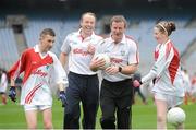 10 October 2012; Pictured at the Kellogg’s Cúl Dream Day Out in Croke Park are Niall Clerkin, age 12, from Louth, and Amy Dennehy, age 12, from Burnfort, Co. Cork, with Kellogs ambassadors former Kerry footballer Seamus Moynihan, second from left, and Laois manager Justin McNulty. 82,000 children participated in Kellogg's GAA Cúl Camps in 2012, an increase of almost 6% on 2011, proving that the camps are one of the most popular summer camps, selected by Irish families. Over 1,000 clubs throughout the country hosted Kellogg's GAA Cúl Camps, during the summer of 2012, with the highest numbers participating in GAA strongholds like Dublin, Cork, Galway, Limerick and Kildare. Counties like Meath, Westmeath and Longford also saw a huge surge in camp registrations with numbers up by 41% in Meath, 34% in Westmeath, 21% in Mayo, 20% in Longford and 8% in Donegal. Croke Park, Dublin. Picture credit: Brian Lawless / SPORTSFILE