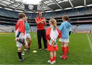10 October 2012; Pictured at the Kellogg’s Cúl Dream Day Out in Croke Park is Down footballer Brendan Coulter with participants. 82,000 children participated in Kellogg's GAA Cúl Camps in 2012, an increase of almost 6% on 2011, proving that the camps are one of the most popular summer camps, selected by Irish families. Over 1,000 clubs throughout the country hosted Kellogg's GAA Cúl Camps, during the summer of 2012, with the highest numbers participating in GAA strongholds like Dublin, Cork, Galway, Limerick and Kildare. Counties like Meath, Westmeath and Longford also saw a huge surge in camp registrations with numbers up by 41% in Meath, 34% in Westmeath, 21% in Mayo, 20% in Longford and 8% in Donegal. Croke Park, Dublin. Picture credit: Brian Lawless / SPORTSFILE