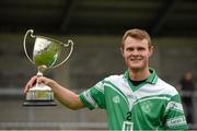 14 October 2012; Lucan Sarsfields' corner back Alan Clarke with the Johnny Maher Cup. The cup had been presented moments earlier but was damaged as his team-mates celebrated. Dublin County Junior B Hurling Championship Final, Cuala v Kilmacud Crokes, Parnell Park, Dublin. Picture credit: Ray McManus / SPORTSFILE