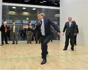 15 October 2012; Leo Varadkar, T.D., Minister for Transport, Tourism and Sport, tries out his handball skills, alongside Uachtarán CLG Liam Ó Néill, during the opening ceremony of the championships which are taking place in the Citywest Hotel & Conference Centre until the 21st of October. World Handball Championships, Citywest Hotel & Conference Centre, Saggart, Co. Dublin. Picture credit: Barry Cregg / SPORTSFILE