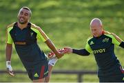 17 October 2012; Munster's Simon Zebo is given a 'helping hand' by team-mate Peter Stringer as they stretch during squad training ahead of their side's Heineken Cup, Pool 1, Round 2, game against Edinburgh on Sunday. Munster Rugby Squad Training, University of Limerick, Limerick. Picture credit: Diarmuid Greene / SPORTSFILE