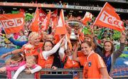 7 October 2012; Sinead McCleary, Armagh, celebrates with supporters following her side's victory. TG4 All-Ireland Ladies Football Intermediate Championship Final, Armagh v Waterford, Croke Park, Dublin. Picture credit: Stephen McCarthy / SPORTSFILE