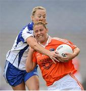 7 October 2012; Shauna O'Hagan, Armagh, in action against Grainne Enright, Waterford. TG4 All-Ireland Ladies Football Intermediate Championship Final, Armagh v Waterford, Croke Park, Dublin. Picture credit: Stephen McCarthy / SPORTSFILE