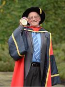 19 October 2012; World-Renowned Athletics Coach Brother Colm O’Connell has received an Honorary Doctorate from Dublin City University in recognition of his contribution to sport through his athletics coaching proramme in Kenya's Rift Valley. Brother Colm was accompanied to DCU by one of his protégés, David Rudisha, world record holder and winner of the 800m Gold medal at the London 2012 Olympics. Pictured at the event is Brother Colm O’Connell with David Rudisha's Gold medal. Dublin City University, Glasnevin, Dublin. Picture credit: Brian Lawless / SPORTSFILE