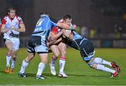 19 October 2012; Tommy Bowe, Ulster, with support from team-mate Andrew Trimble, is tackled by Ryan Grant, left, and Al Kellock, Glasgow Warriors. Heineken Cup 2012/13, Pool 4, Round 2, Glasgow Warriors v Ulster, Scotstoun Stadium, Glasgow, Scotland. Picture credit: Barry Cregg / SPORTSFILE