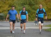 22 October 2012; Leinster's Cian Healy, left, John Cooney and Leo Cullen, right, make their way to squad training ahead of their side's Celtic League, Round 7, match against Cardiff Blues on Saturday. Leinster Rugby Squad Training, Rosemount, UCD, Belfield, Dublin. Picture credit: Barry Cregg / SPORTSFILE