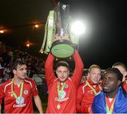 26 October 2012; Mark Quigley, Sligo Rovers, celebrates with the Airtricity League Premier Division trophy with team-mates Gavin Peers, left, and Pascal Millien. Airtricity League Premier Division, Sligo Rovers v Shamrock Rovers, Showgrounds, Sligo. Picture credit: David Maher / SPORTSFILE