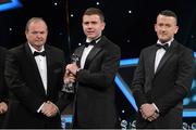 26 October 2012; Conor Woods, Down, is presented with his 2012 Christy Ring Champion 15 Award by Liam Ó Néill, left, Uachtarán, Chumann Lúthchleas Gael and Donal Og Cusack, right, Chairman, Gaelic Players Association. GAA GPA All-Star Awards 2012, National Convention Centre, Dublin. Picture credit: Brendan Moran / SPORTSFILE