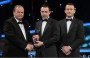 26 October 2012; Lee Henderson, Donegal, is presented with his 2012 Nicky Rackard Champion 15 Award by Liam Ó Néill, left, Uachtarán, Chumann Lúthchleas Gael and Donal Og Cusack, right, Chairman, Gaelic Players Association. GAA GPA All-Star Awards 2012, National Convention Centre, Dublin. Picture credit: Brendan Moran / SPORTSFILE