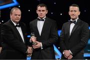 26 October 2012; Brian Donnelly, Roscommon, is presented with his 2012 Nicky Rackard Champion 15 Award by Liam Ó Néill, left, Uachtarán, Chumann Lúthchleas Gael and Donal Og Cusack, right, Chairman, Gaelic Players Association. GAA GPA All-Star Awards 2012, National Convention Centre, Dublin. Picture credit: Brendan Moran / SPORTSFILE
