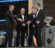 26 October 2012; Donegal's Neil McGee receives his 2012 GAA GPA All-Star award, sponsored by Opel, from Donal Og Cusack, Chairman, Gaelic Players Association, Liam Ó Néill, Uachtarán, Chumann Lúthchleas Gael, and Dave Sheeran, Managing Director, Opel Ireland. GAA GPA All-Star Awards 2012 Sponsored by Opel, National Convention Centre, Dublin. Picture credit: Brendan Moran / SPORTSFILE
