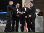 26 October 2012; Donegal's Frank McGlynn receives his 2012 GAA GPA All-Star award, sponsored by Opel, from Donal Og Cusack, Chairman, Gaelic Players Association, Liam Ó Néill, Uachtarán, Chumann Lúthchleas Gael, and Dave Sheeran, Managing Director, Opel Ireland. GAA GPA All-Star Awards 2012 Sponsored by Opel, National Convention Centre, Dublin. Picture credit: Brendan Moran / SPORTSFILE