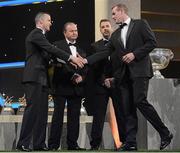 26 October 2012; Donegal's Neil Gallagher receives his 2012 GAA GPA All-Star award, sponsored by Opel, from Donal Og Cusack, Chairman, Gaelic Players Association, Liam Ó Néill, Uachtarán, Chumann Lúthchleas Gael, and Dave Sheeran, Managing Director, Opel Ireland. GAA GPA All-Star Awards 2012 Sponsored by Opel, National Convention Centre, Dublin. Picture credit: Brendan Moran / SPORTSFILE