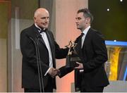 26 October 2012; Donegal's Karl Lacey receives his 2012 GAA GPA Footballer of the Year award, sponsored by Opel, from former Donegal footballer Anthony Molloy. GAA GPA All-Star Awards 2012 Sponsored by Opel, National Convention Centre, Dublin. Picture credit: Brendan Moran / SPORTSFILE