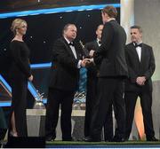 26 October 2012; Waterford's Kevin Moran receives his 2012 GAA GPA All-Star award, sponsored by Opel, from Liam Ó Néill, Uachtarán, Chumann Lúthchleas Gael,  Donal Og Cusack, Chairman, Gaelic Players Association, and Dave Sheeran, Managing Director, Opel Ireland. GAA GPA All-Star Awards 2012 Sponsored by Opel, National Convention Centre, Dublin. Picture credit: Brendan Moran / SPORTSFILE
