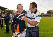 27 October 2012; Ireland's Tommy Walsh and manager John Meyler celebrate after victory over Scotland. Shinty International, Second Test, Scotland v Ireland, Cusack Park, Ennis, Co. Clare. Picture credit: Diarmuid Greene / SPORTSFILE