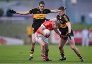 28 October 2012; Paul Devane, Dingle, in action against Brian Looney and Kieran O'Leary, right, Dr. Crokes. Kerry County Senior Football Championship Final, Dingle v Dr. Crokes, Austin Stack Park, Tralee, Co. Kerry. Picture credit: Stephen McCarthy / SPORTSFILE